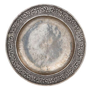 
	
		A rare early chased and repousse work silver dish, India, 17th century, of deep form with...