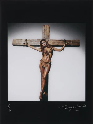 Terry O'Neill CBE,&nbsp;British 1938-2019,&nbsp;Raquel Welch on a Cross, 1970;&nbsp;R-print (reversal print) with...