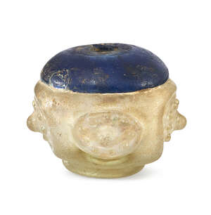 
	
		A fine cobalt and clear glass moulded bottle base, Iran, 10th-11th century, on a pad...