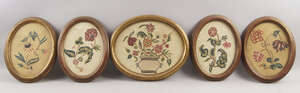 
	
		Four Victorian oval crewel work embroidered pictures of sprays of flowers, 22.5 x 16.5cm,...