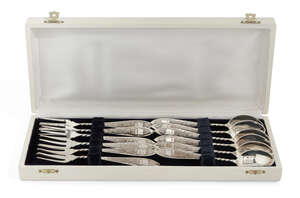 
	
		A cased set of Greek silver cake eaters, comprising six each cake spoons and forks, each...