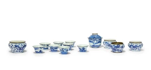 A collection of Chinese metal-mounted blue and white wares for the Thai-market 
Qing dynasty, 19th century
Comprising: a set of four cups painted with figurati