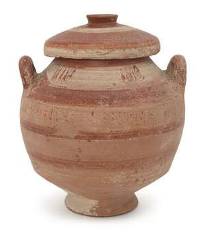 A Messapian pottery lidded stamnos, circa 4th century BC., the lid with banded decoration in red and cream slip, the rounded body similarly decorated with addi