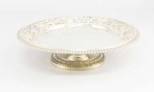 
	
		A George V heavy gauge silver cake stand, London c.1910, the circular dish with pierced...