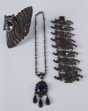 
	
		A Mexican Sterling silver and amethyst set bracelet, the wide leaf form panels centred...