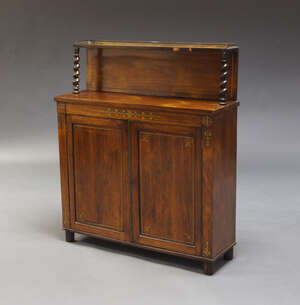 
	
		A Regency rosewood and brass inlaid chiffonier, the top shelf with pierced brass gallery,...