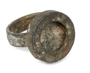 
	
		A Roman large bronze ring missing intaglio, 1st-2nd century A.D., 2.9cm. diam. 
		 
		