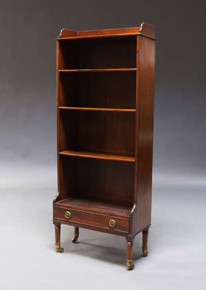 
	
		A Regency style mahogany open bookcase, 19th Century, with five shelves above base...