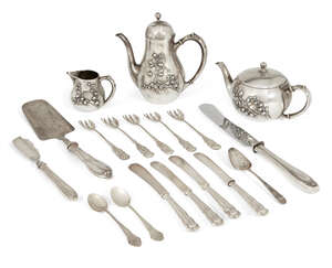 
	
		A German silver three-piece bachelor tea set, comprising teapot, hot water pot and milk...