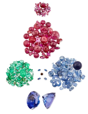 A group of unmounted gemstones, all broken or chipped, to include rubies, weighing approximately...