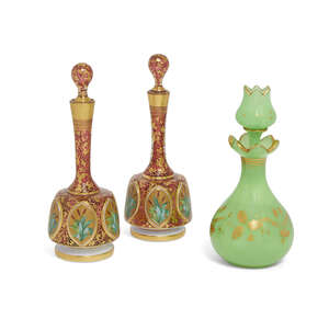 
	
		A pair of Continental glass bottles and stoppers, 19th century, decorated with panels of...