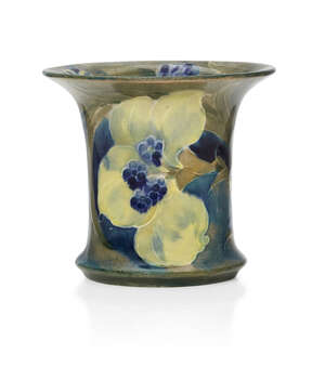 
	
		William Moorcroft (1872-1945), a small ceramic vase      
		c.1916, signed in green W...