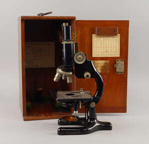 
	
		A Cooke, Troughton and Sims microscope, mid 20th century, with various lenses, , in a...