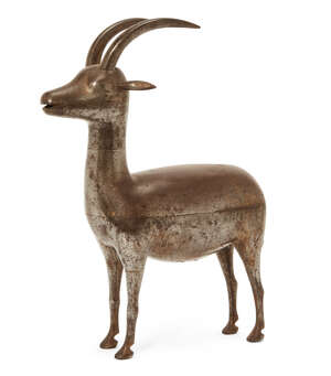 
	
		A Qajar gold and silver-damascened steel Ibex, Persia, 19th century,  standing upright...