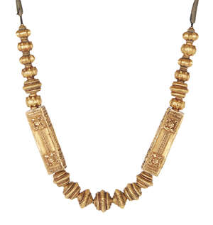 
	
		A South Indian gold necklace, 19th century, comprised of a series of graduating fluted...