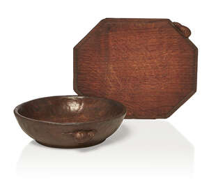 
	
		Robert Thompson (British 1876-1955), a 'Mouseman' oak bowl and cheeseboard 
		c.1935,...