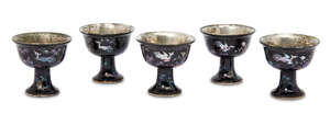 
	
		A set of five lac burgauté mother of pearl inlaid stem cups, Kangxi period, each with...