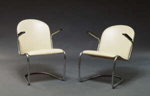 
	
		A pair of cantilever armchairs, c.1950s, of tubular steel construction, upholstered in...