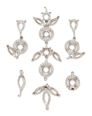 A group of vacant collets,&nbsp;comprising vacant marquise-shaped collets and round collets within...