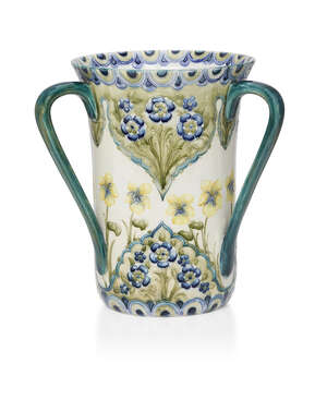 
	
		William Moorcroft (1872-1945), a Forget-Me-Not pattern three-handled ceramic vase
		