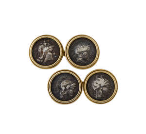 A pair of ancient Greek silver coin set cufflinks, each coin obverse depicting the head of Athena, in collet mount with ropework border and chain link connecti