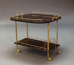 
	
		Aldo Tura (1909-1963), a brown lacquered goatskin and brass two tier serving trolley ...