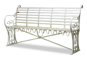 
	
		An Edwardian white-painted wrought-iron garden seat, early 20th Century, with scrolling...