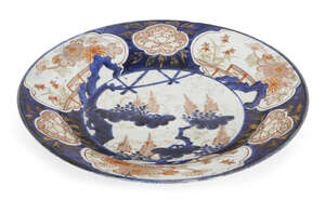 
	
		A Japanese Arita Imari porcelain charger, 17th century, decorated with flowers and...