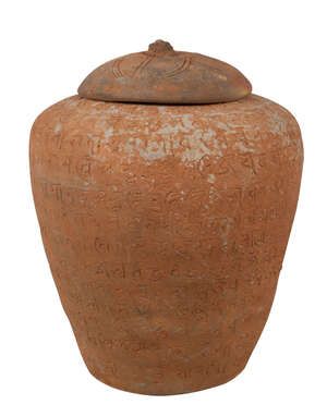 A Chinese terracotta lidded jar with Sanskrit inscriptions, Han dynasty, Hunan province, 20cm high
		 
		 