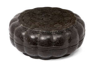 
	
		A large Chinese black lacquer lobed circular box, early 20th century, incised throughout...
