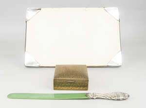
	
		A silver-mounted, green stained ivory page turner, London c.1901, the silver handle of...