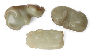
	
		Three Chinese green jade cats, early 20th century, each carved in recumbent pose, 4.5cm -...