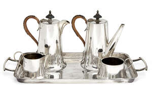 
	
		A four piece café-au-lait set with twin-handled silver tray, Sheffield, c.1931-1935,...