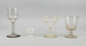 
	
		A tall wine glass, 18th century, with bucket form bowl decorated to the base with writhen...