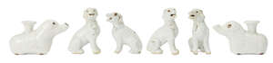 
	
		Two pairs of Chinese porcelain hounds and a pair of 'elephant' taper holders, 18th...