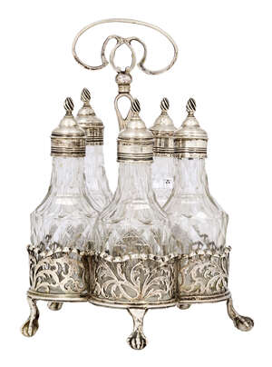 
	
		A George III silver cruet set, London, c.1764, Edward Aldridge, the five cut glass cruets...