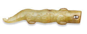 
	
		A Chinese green jade archaistic pendant, 17th century, carved as a crocodile engraved...