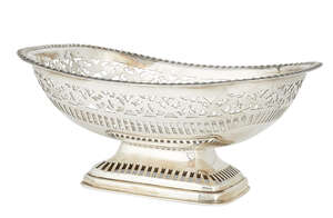A large silver dish with pierced border, Sheffield, c.1928, James Deakin & Sons., raised on a pierced, rectangular foot, the rim with gadroon decoration to pie