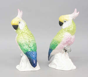 
	
		A pair of Crown Staffordshire bone china models of cockatoos, after a design by J T...