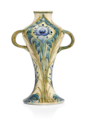
	
		William Moorcroft (1872-1945), a Peacock pattern twin-handled ceramic vase      
		