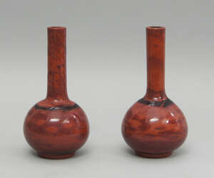 
	
		A pair of Chinese Peking glass red ochre bottle vases, 20th century, 23cm high (2)

	

