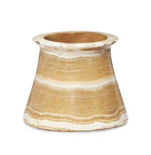 A Bactrian alabaster vessel, 3rd millennium B.C., the tapering cylindrical bowl with a disk rim, 7.4cm. high x 8.6cm. diam. (at base)
		Provenance: Property o