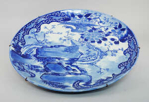 
	
		A large Japanese blue and white charger, mid/late19th century, painted with a view of...
