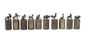 
	
		Ten Chinese white metal Zodiac seals, early 20th century, each cast with an animal atop a...