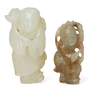 
	
		Two Chinese jade boy figures, 18th and 19th century, one of greenish-white tone finely...
