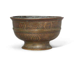 An unusual footed bronze bowl, Deccan, India, 18th century, on a splayed foot, with rounded...