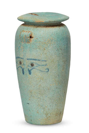 An Egyptian turquoise glazed composition cosmetic jar, New Kingdom, 18th Dynasty, circa 1550-1295 BC., the tapering piriform body with flat circular base, two 