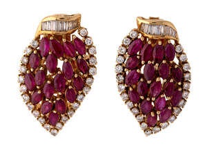 
	
		A pair of ruby and diamond ear clips, each of leaf design claw set with navette-cut...