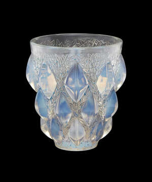 
	
		René Lalique (1860-1945), an opalescent glass vase with traces of blue staining
		