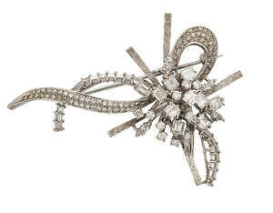 
	
		A diamond cluster brooch, designed as a floral spray the central claw-set circular and...